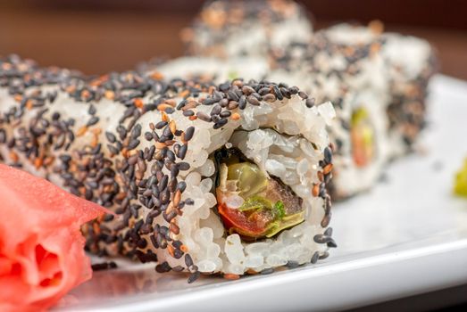 Closeup of Sushi rolls at plate with sesame