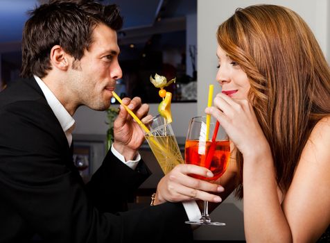 Young cheerful couple having good time together