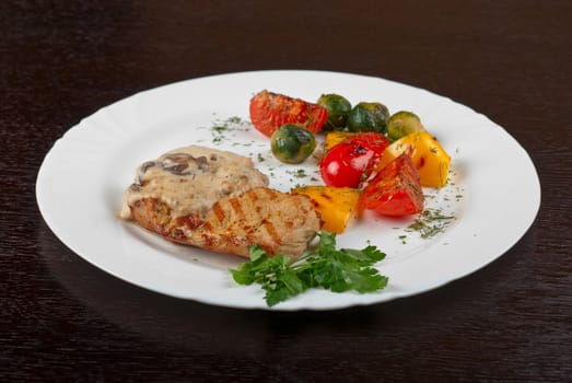 pork steak with mushroom sauce and grilled vegetables