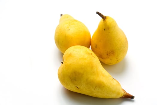 Yellow ripe juicy pears on white background