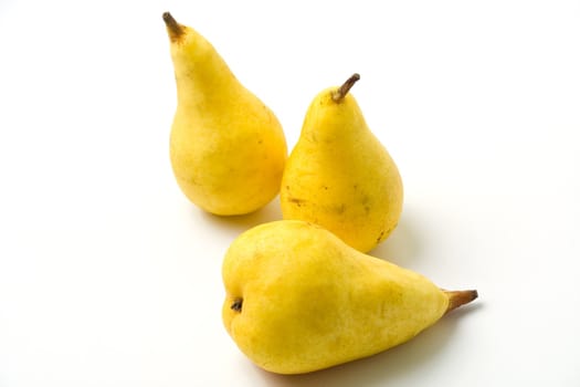 Yellow ripe juicy pears on white background