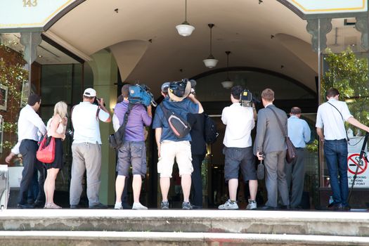 The press and photographers wait on steps of Sydney Courthouse for the tried to exit. 2011.