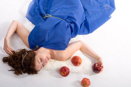 Lady in blue antique dress and red apples on white background
