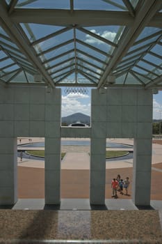 Tourists approach the entrance to Canberra's Parliament House, Australia in 2011.