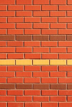 Red Brick Wall with Feature Rows of Yellow and Brown