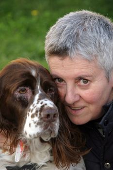 mature woman with dog in the park