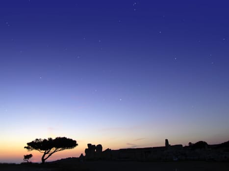 The oldest free-standing building/temple in the world. Oldest neolithic prehistoric temple built thousands of years before the pyramids. - Hagar Qim & Mnajdra Temples in Malta, Mediterranean Sea, Europe - here seen silhouetted at sunset