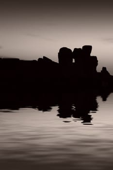 The oldest free-standing building/temple in the world. Oldest neolithic prehistoric temple built thousands of years before the pyramids. - Hagar Qim & Mnajdra Temples in Malta, Mediterranean Sea, Europe - here seen silhouetted at sunset