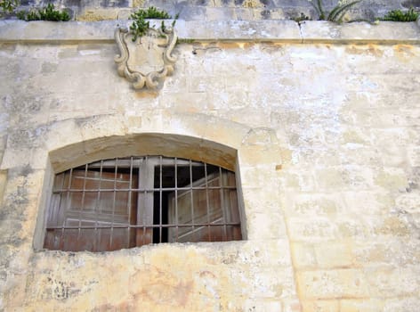 Medieval prison window in the old city of Mdina, Malta