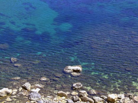 Typical rocky coastline in Malta, punctuated with sheer drops and jagged cliffs