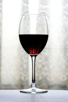 glass of wine over white grey background