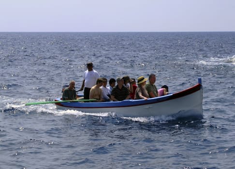 Group of tourists on leisure boat in Malta