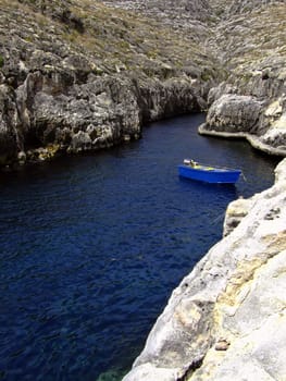 Typical rocky coastline in Malta, punctuated with sheer drops and jagged cliffs