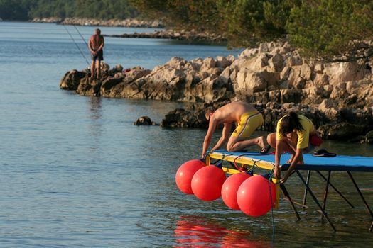 Man and woman tie buoy