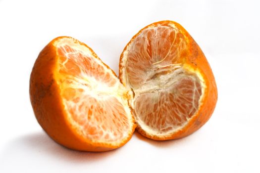 A opened mandarin oranges on white background. Lunar New Year item.