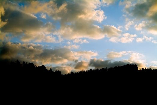 clouds in sunset and mountain silhouette