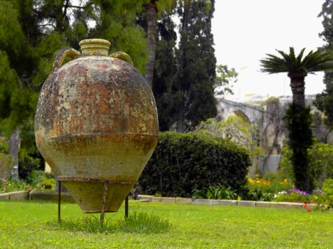 Antique wine amphora used as decor in gardens