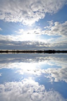 Beutiful clouds with reflection in water