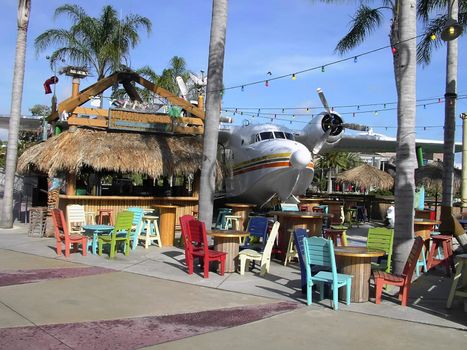 Tropical cabana on the coast in the Caribbean; with seaplane next to it