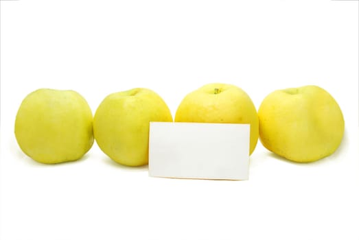 Four Yellow Apples with Blank Advertisement Card Isolated on White