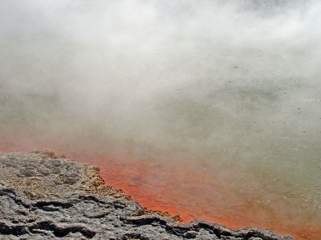 Steam and bubbles from the Geothermal Activity at the Champagne Pool of Waiotapu Thermal Reserve, Rotorua, New Zealand