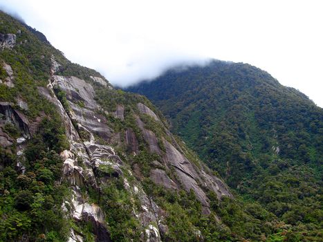 Cliff faces of the mountains containing Milford Sound, New Zealand