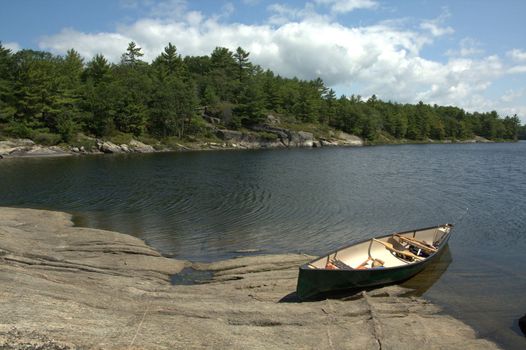 A view of a canoe in the Honey Harbour area of Georgian Bay, on a beautiful sunny day.