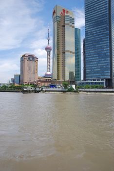 Skyline view of Shanghai China and river.