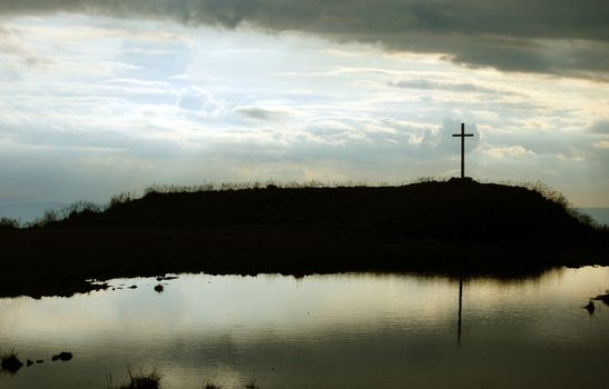 Cross above the lake marked the high peak of the mountains
