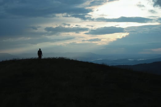 lonely man travelling over the tops of the Carpathian mountains
