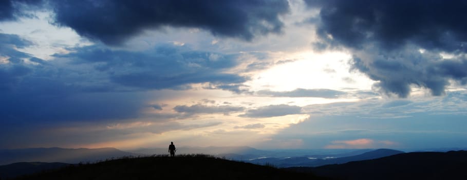 lonely man travelling over the tops of the Carpathian mountains