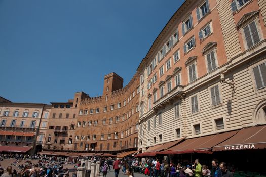Piazza del Campo, famous sloping and shell shaped public "square" of Siena, Italy