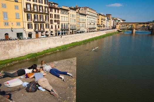 Students in view of Ponte vecchio, from another bridge, Florence, Italy.