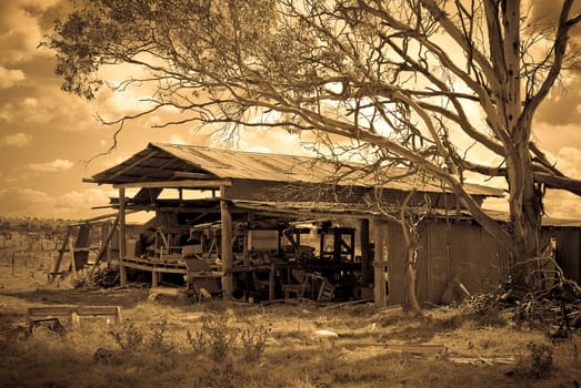 an old farm shed and equipment falling down