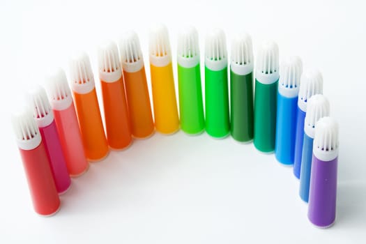 Set of colored markers on white background