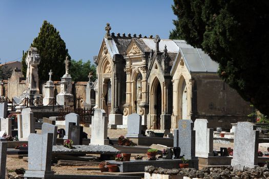 old mediterranean graveyard with large stone graves