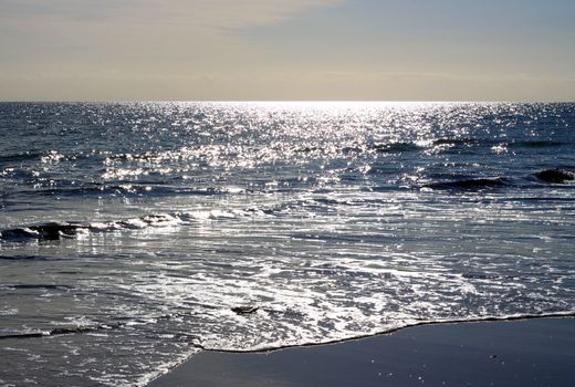 Sparkling Sunlight Reflections on the Water of Grange Beach, Adelaide, Australia