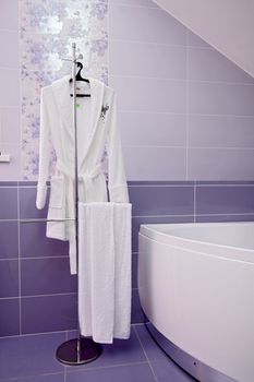 The spacious modern bathroom which has been laid out by a tile