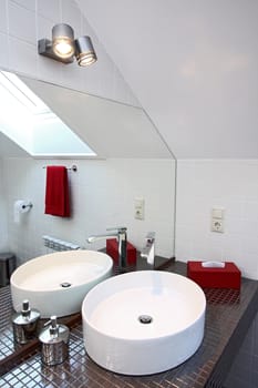 The spacious modern bathroom which has been laid out by a tile
