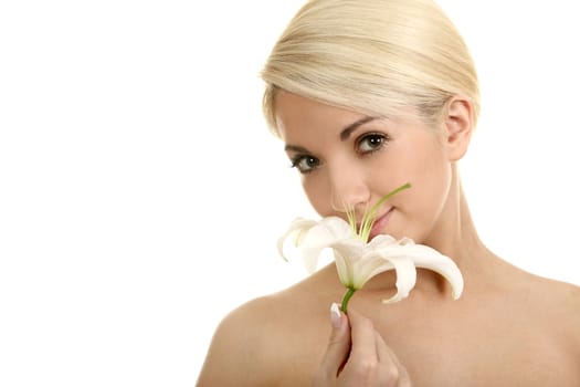 The beautiful girl, the blonde with a white lily on a white background
