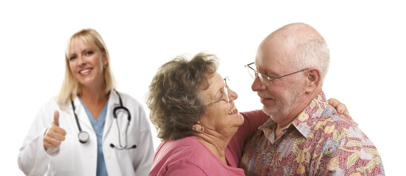 Senior Couple with Medical Doctor or Nurse with Thumbs Up Behind.