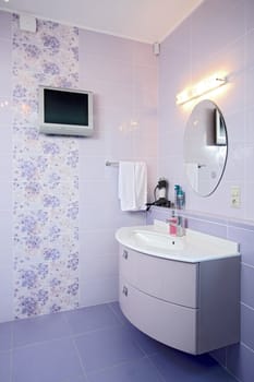 The spacious modern bathroom which has been laid out by a tile
