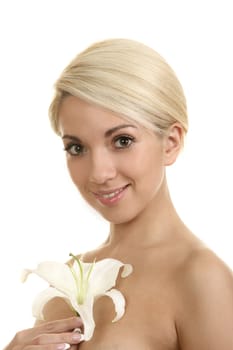 The beautiful girl, the blonde with a white lily on a white background
