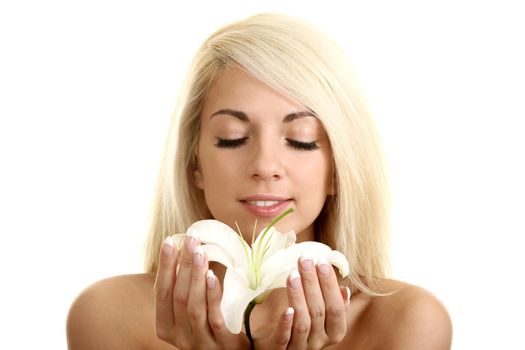 The beautiful girl, the blonde with a white lily on a white background
