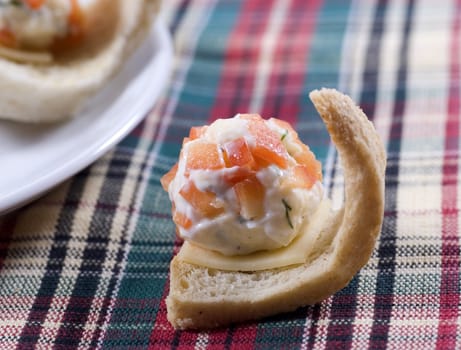 Delicious appetizers crackers with cream cheese 