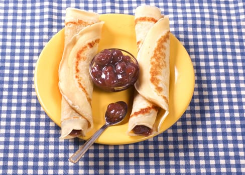 Two pancakes with strawberries jam 