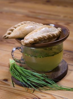  A traditional Karaite pasty-kibin with bouillon and onion