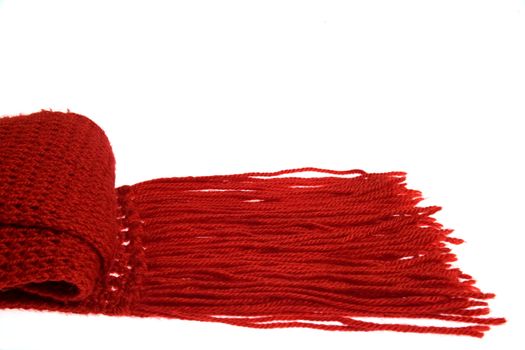 A woolen red scarf with long fringes.