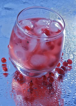 cold red currant drink with ice
