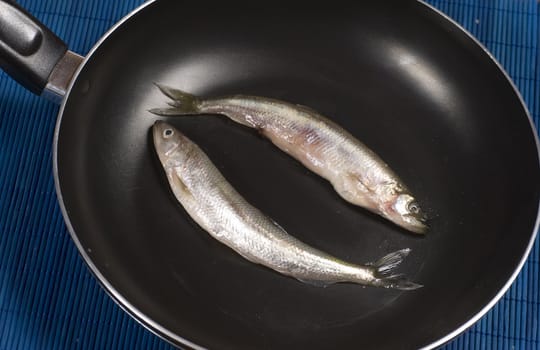 two smelt on pan